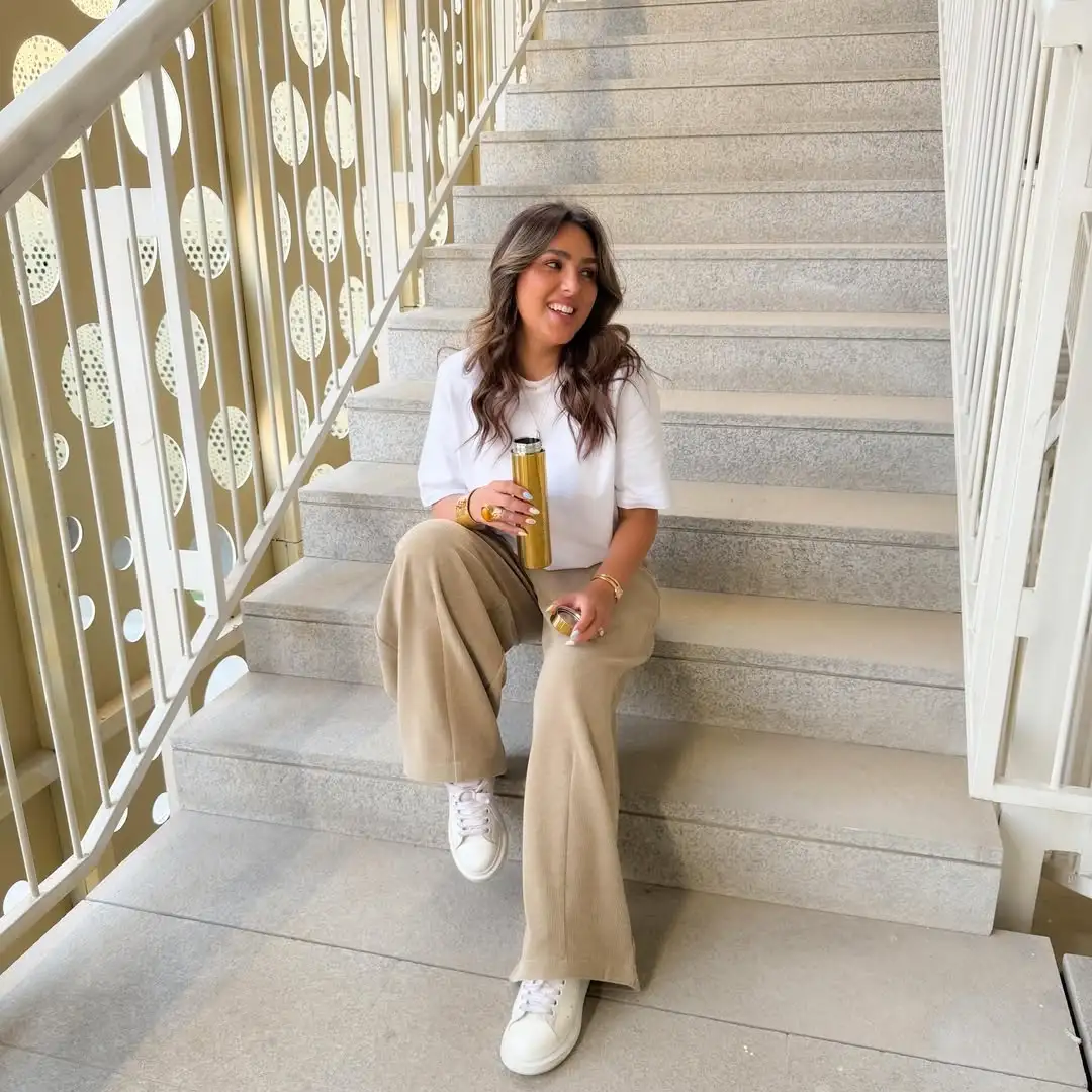 16 Corduroy Outfits for Women Over 40 13 12. White Tee and Tan Corduroy Flared Trousers