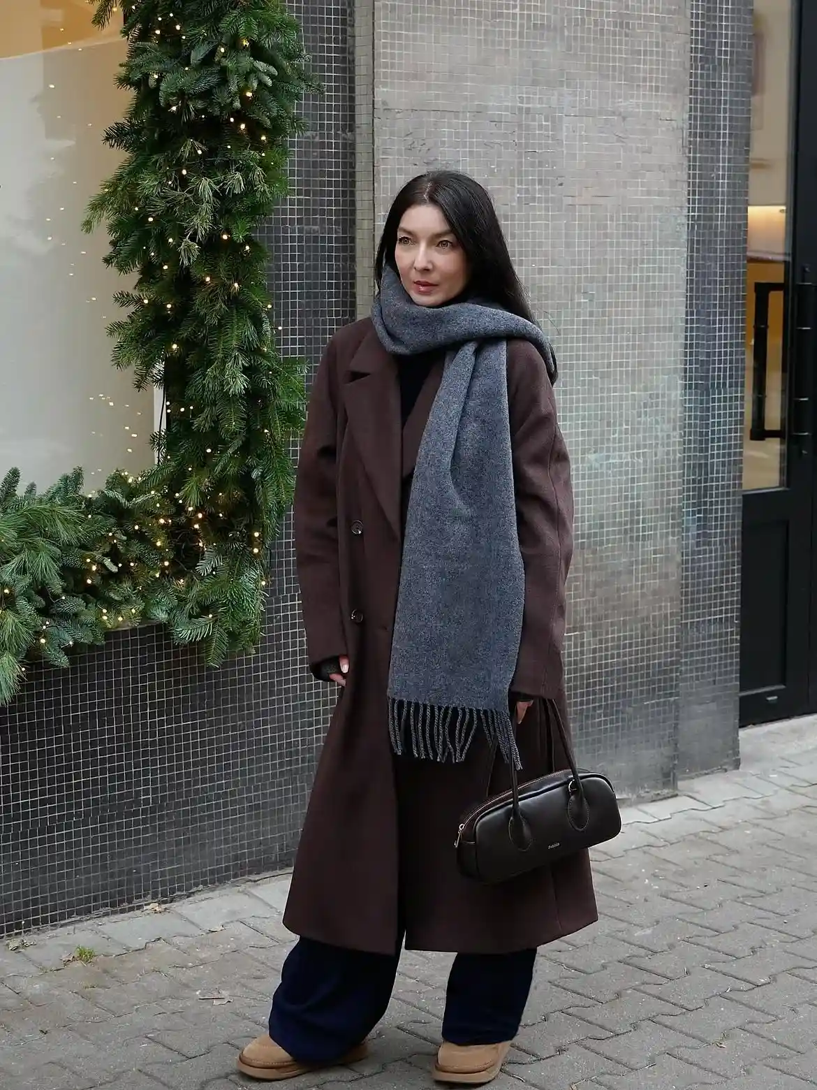 18 Wool Coat Outfits for Women Over 40 You Can Copy This Winter 10 9. Chocolate Brown Wool Coat With a Long Gray Scarf and Wide Leg Pants
