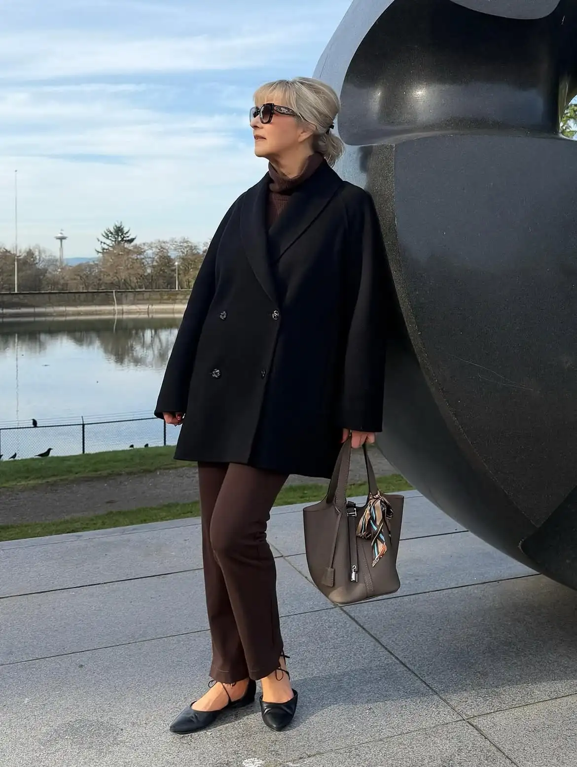 18 Wool Coat Outfits for Women Over 40 You Can Copy This Winter 6 5. Short Black Wool Coat With Chocolate Brown Pants and Flats