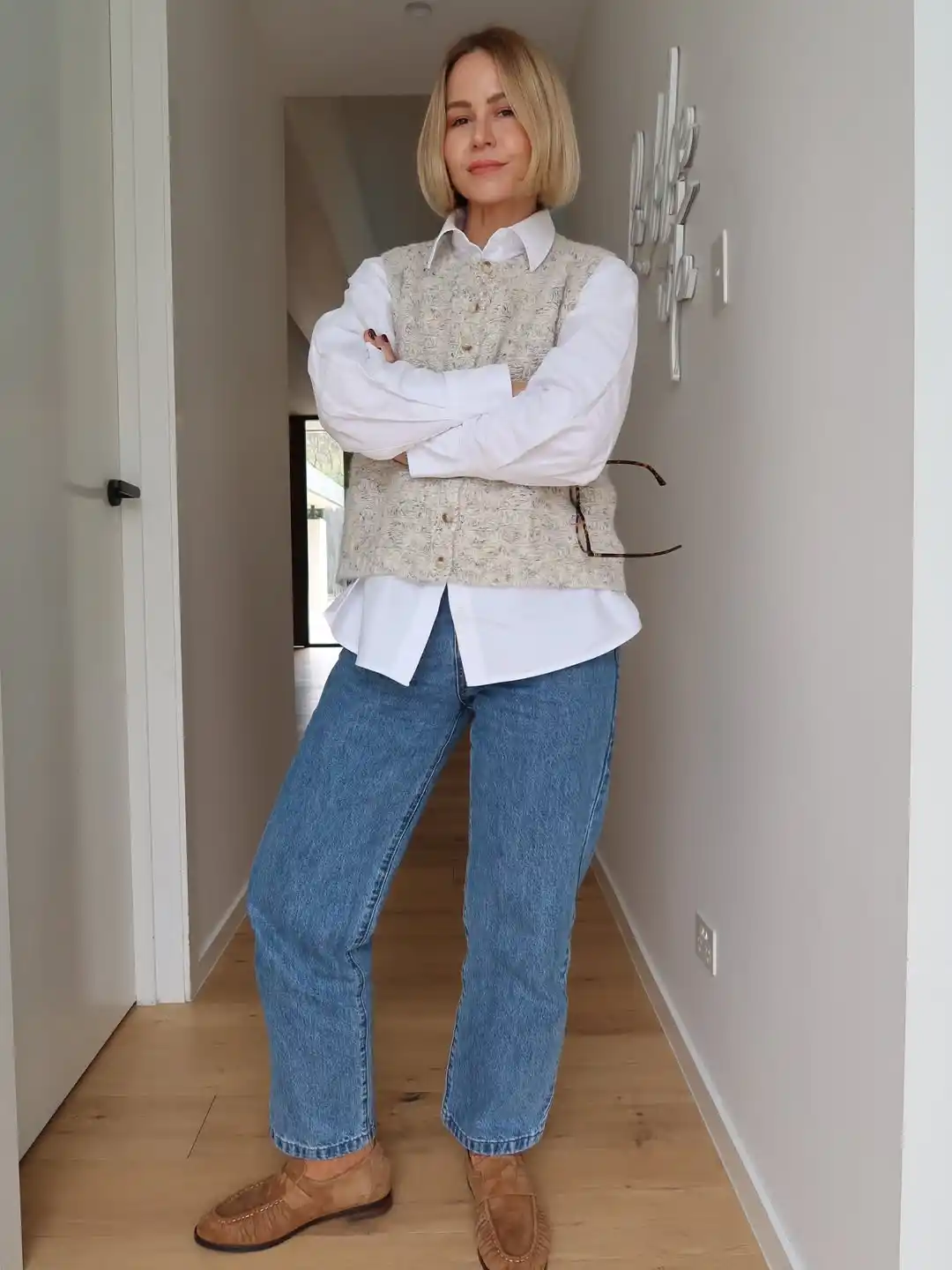 18 Winter Work Outfits for Women Over 40 11 A Knit Vest Over A Crisp Shirt For Easy Layering