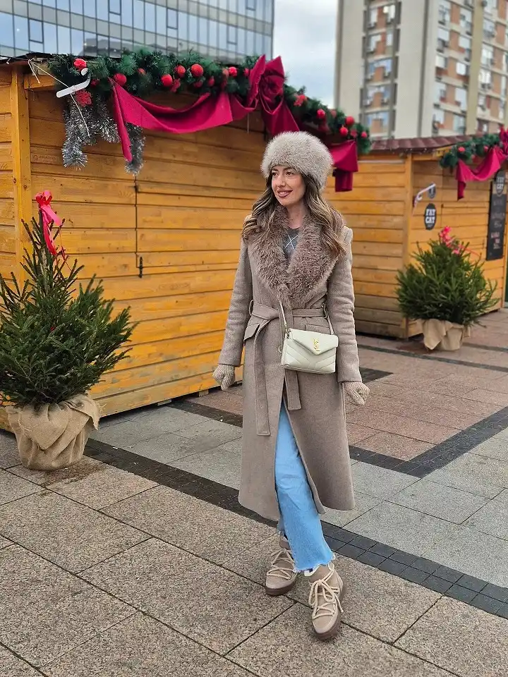 18 Winter 2026 Outfits for Women Over 40 18 A Belted Wrap Coat With a Faux Fur Collar for Christmas Market Days