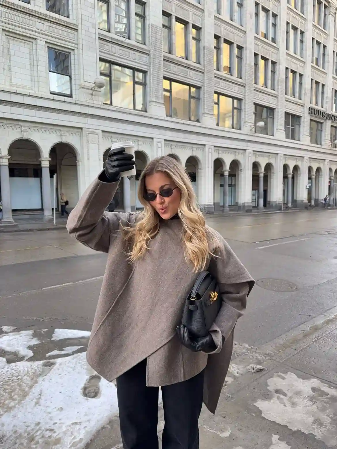 19 Winter Vacation Outfits Over 40 (Warm Getaways) 12 11. Taupe Wool Cape With Black Gloves