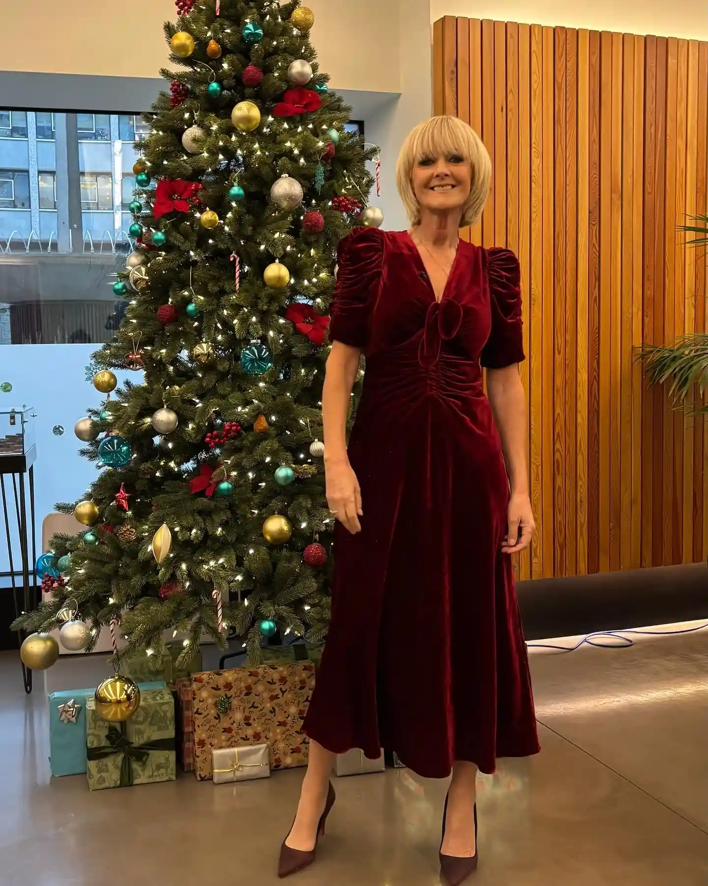 15 Velvet Outfits for Women Over 40 to Wear All Season 7 6. Ruby Red Velvet Midi Dress With Puff Sleeves