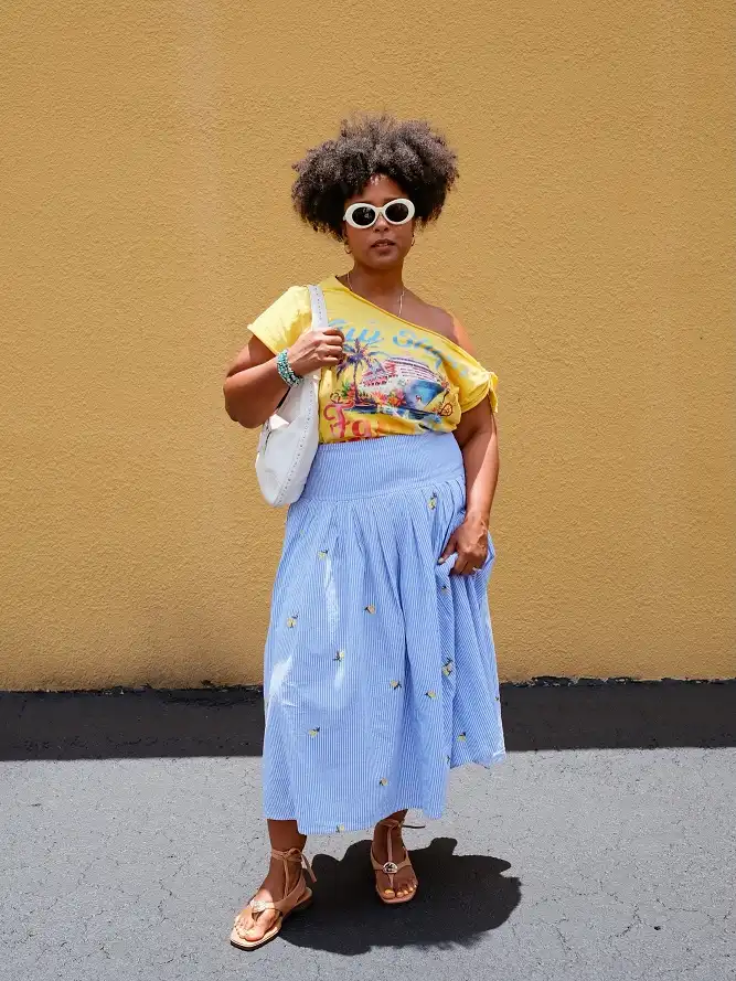Graphic Tee with a Pinstripe Midi Skirt