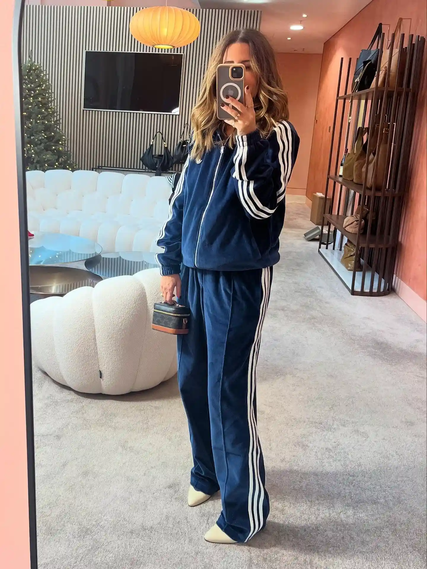 15 Velvet Outfits for Women Over 40 to Wear All Season 5 4. Navy Velvet Tracksuit Set With Cream Boots