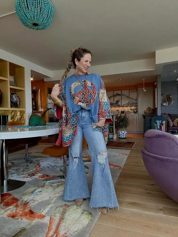 18 Boho Outfits for Women Over 40 (Not Costume-y) 9 Patchwork Peace Sign Top with Super Flare Jeans