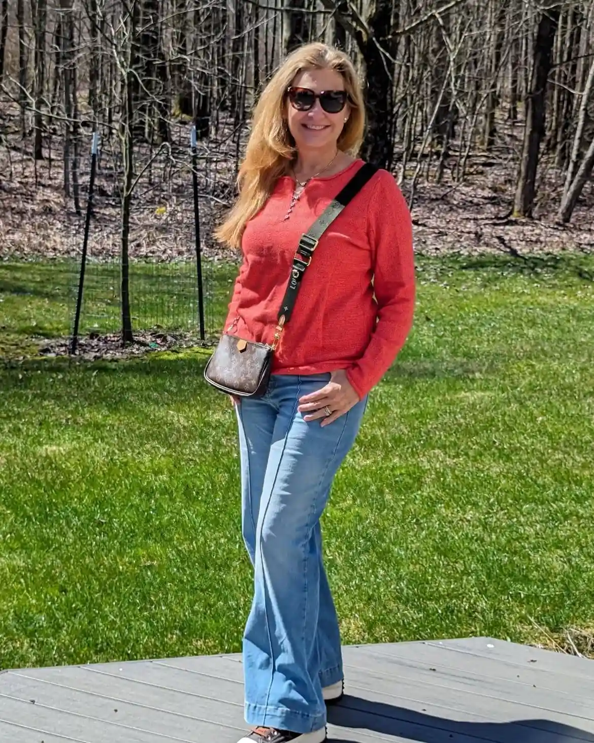 Modern Style: 20 Fall Outfits for Women Over 50 20 19. Coral Sweater with Flare Jeans