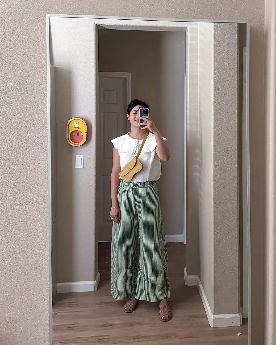 15 Linen Outfits for Women Over 40 That Feel Easy and Look Polished 9 8. Green Striped Pants With a Scalloped Collar Top
