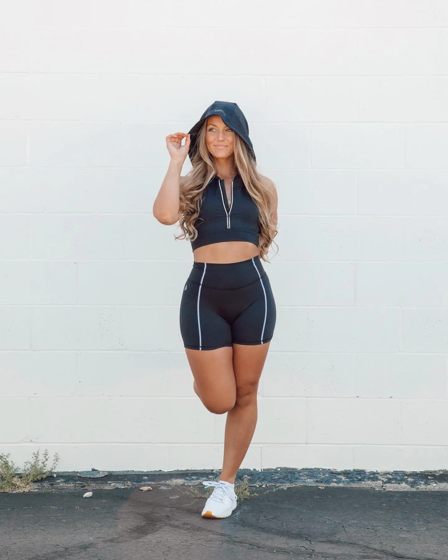 15 Athleisure Outfits for Women Over 40 15 14. Zip Crop Top and Biker Shorts