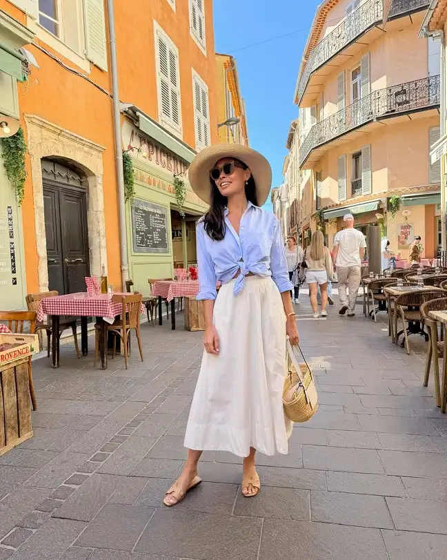 15 European Vacation Outfits for Women Over 40 15 Knotted Blue Shirt with a White Midi Skirt