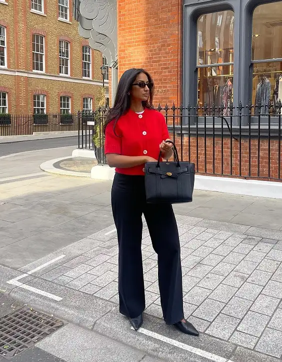 18 Spring Work Outfits for Women Over 40 That Feel Fresh, Not Fussy 9 Red Knit Cardigan and Black Wide Trousers