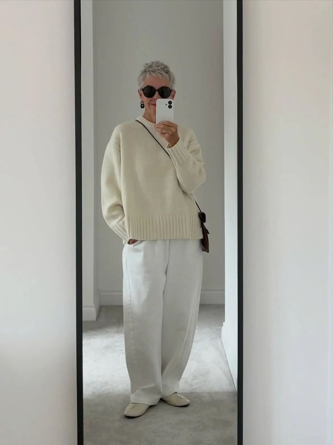 15 Cashmere Outfits for Women Over 40 That Feel Cozy and Polished 15 14. Chunky Cream Sweater With Wide White Pants