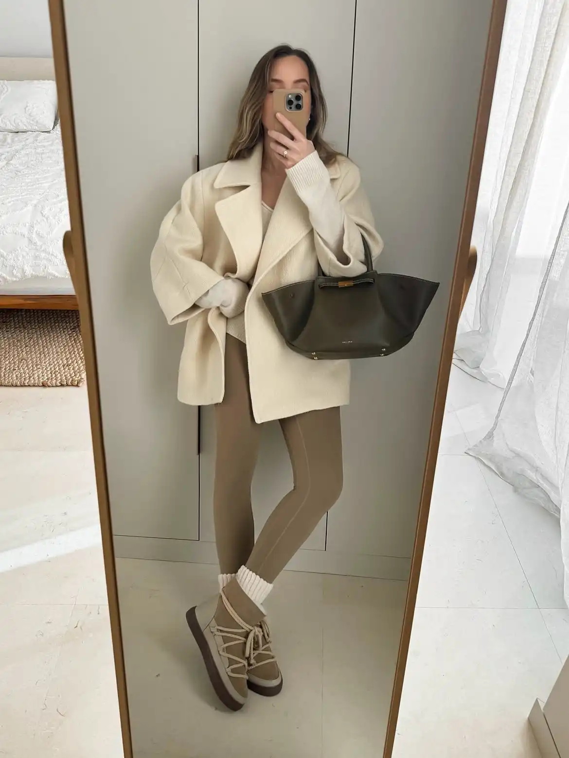 18 Wool Coat Outfits for Women Over 40 You Can Copy This Winter 5 4. Short Cream Wool Coat With Tan Leggings and Suede Boots