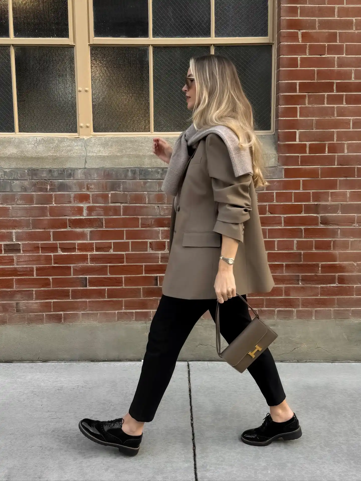 13 Working Mom Outfits Over 40 9 8. Taupe Coat and Black Trousers