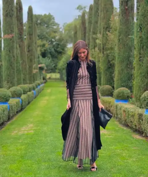 15 Winter Wedding Guest Outfits Over 40 That Handle the Cold 15 Blush Dotted Tulle Maxi Under a Black Velvet Duster
