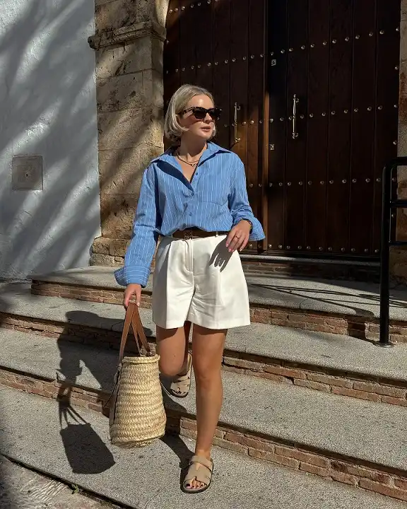 16 Spring Transitional Outfits Over 40 (Winter-to-Spring) 6 Tailored White Shorts With a Blue Striped Shirt
