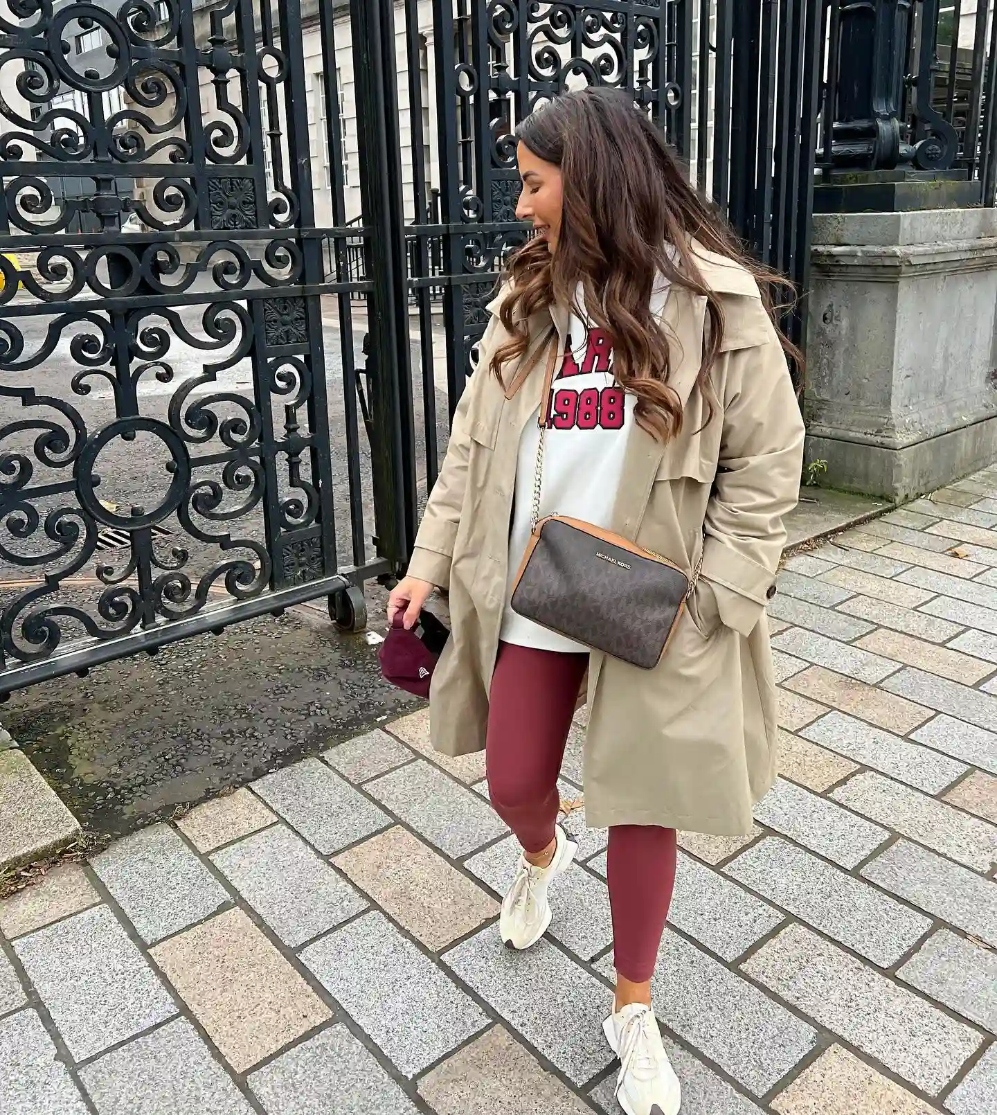 15 Leggings Outfits for Women Over 40 That Don't Look Sloppy 5 4. Trench Coat with Burgundy Leggings