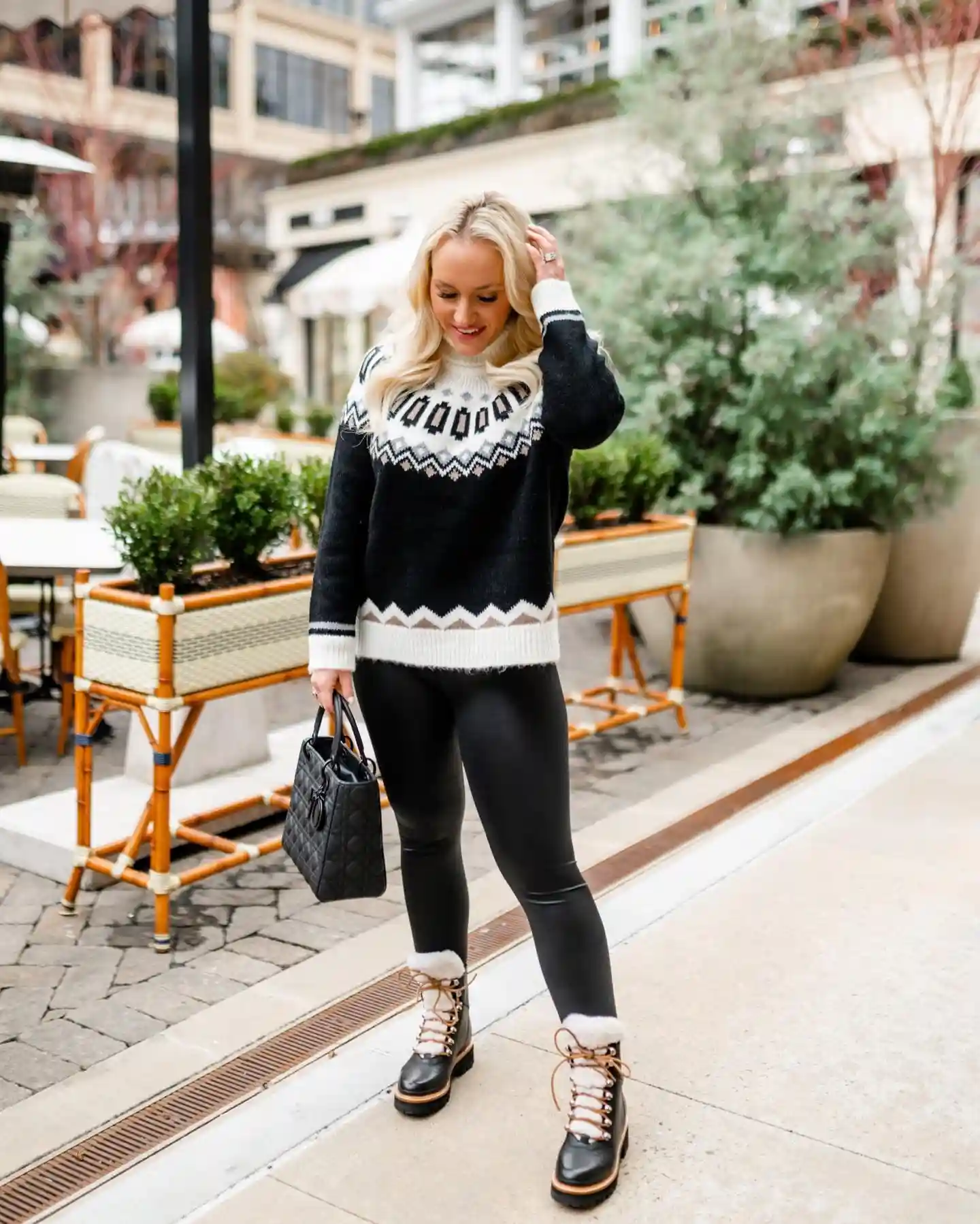 6. Black Fair Isle Sweater With Faux Leather Leggings and Shearling Trim Boots