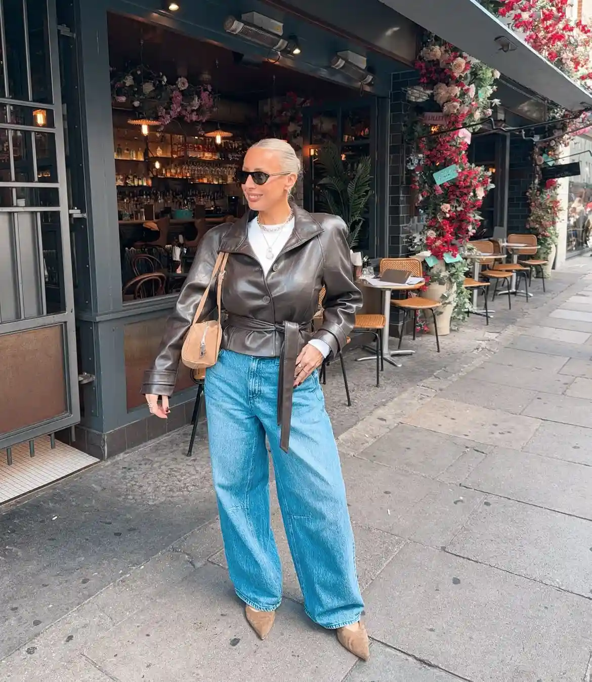 15 Leather Jacket Outfits for Women Over 40 That Actually Work 4 3. Belted Leather Jacket with Wide Leg Jeans