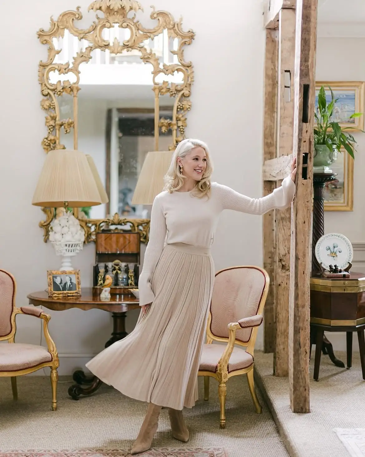 15 Cashmere Outfits for Women Over 40 That Feel Cozy and Polished 10 9. Cream Sweater With a Pleated Knit Midi Skirt