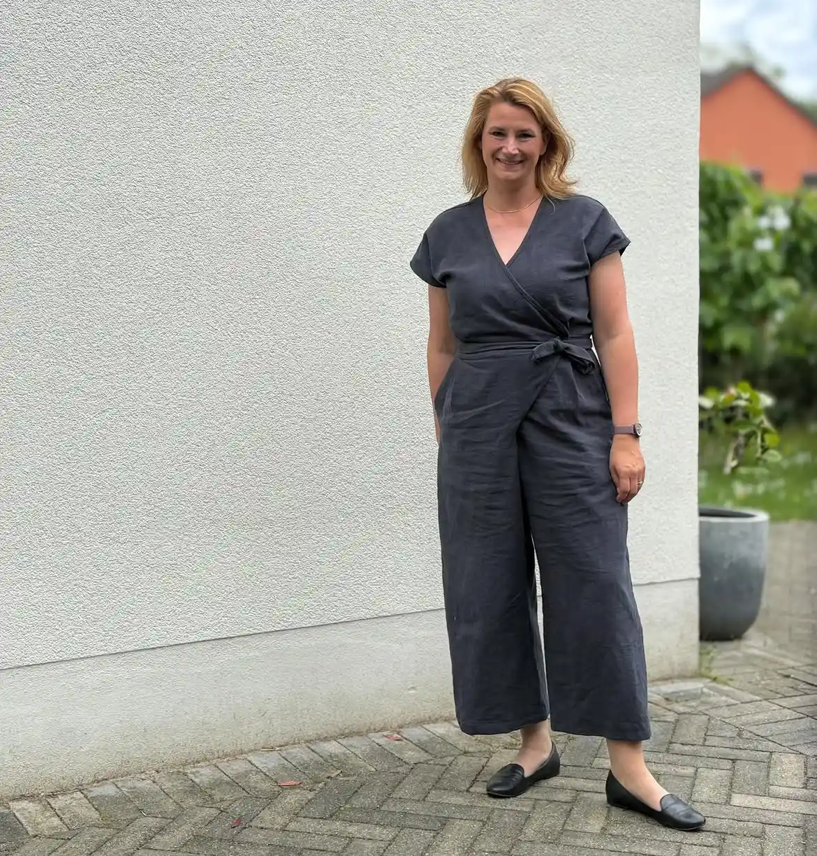 15 Linen Outfits for Women Over 40 That Feel Easy and Look Polished 2 1. Charcoal Wrap Jumpsuit