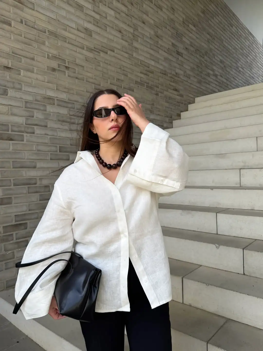 White Linen Shirt with Black Trousers and a Bead Necklace