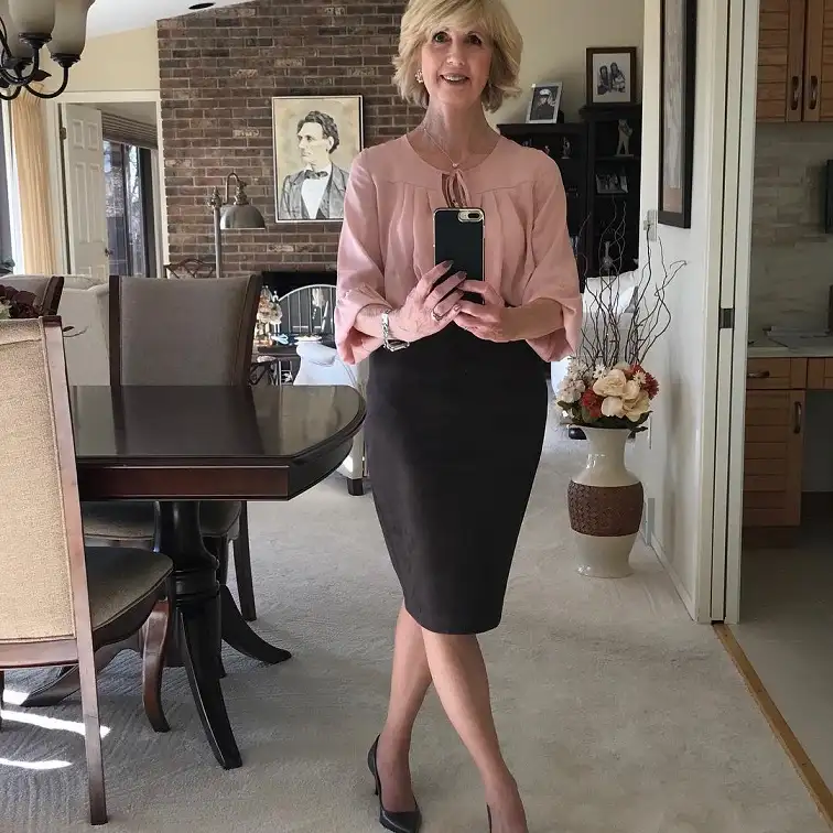 20 Work Outfits for Women Over 40 That Look Effortlessly Polished 4 Blush Tie Neck Blouse with a Brown Pencil Skirt