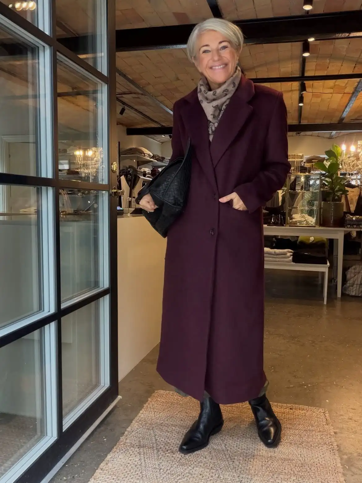 18 Wool Coat Outfits for Women Over 40 You Can Copy This Winter 12 11. Long Burgundy Wool Coat With a Paisley Scarf