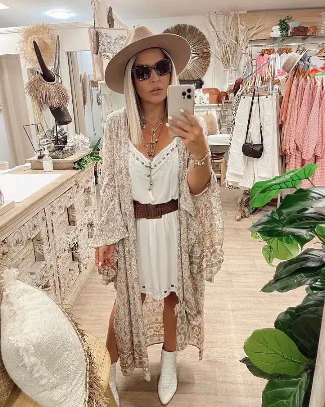 18 Boho Outfits for Women Over 40 (Not Costume-y) 12 White Eyelet Slip Dress with a Paisley Kimono and Felt Hat