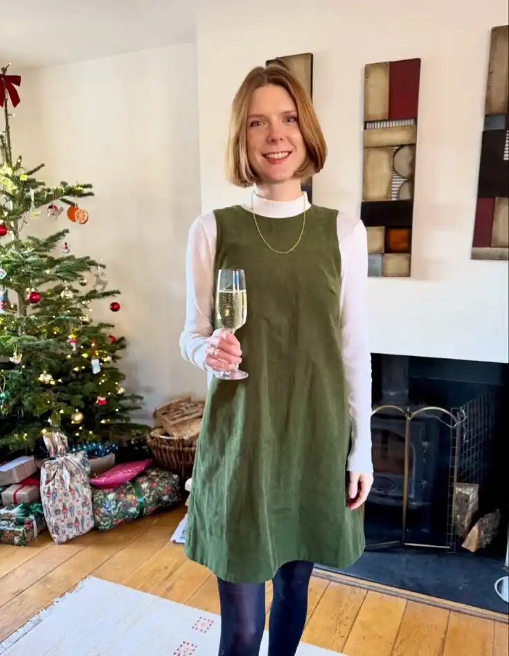 Green Corduroy Pinafore Over a White Ribbed Top