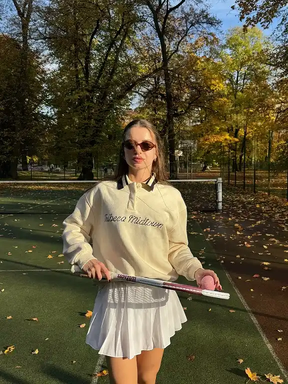A Collared Sweatshirt and Flouncy White Skirt for Crisp Fall Matches