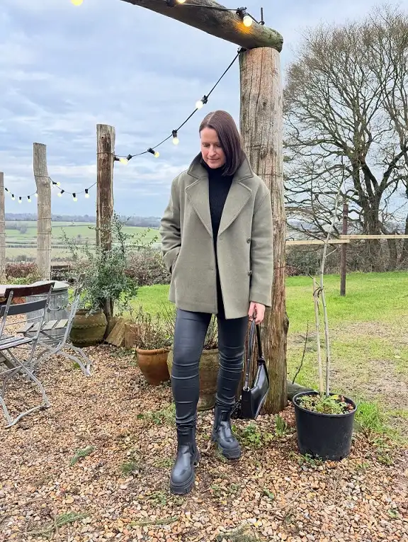 20 Chic Winter Outfits for Women Over 40 That Aren't Frumpy 4 Sage Green Peacoat and Leather Leggings
