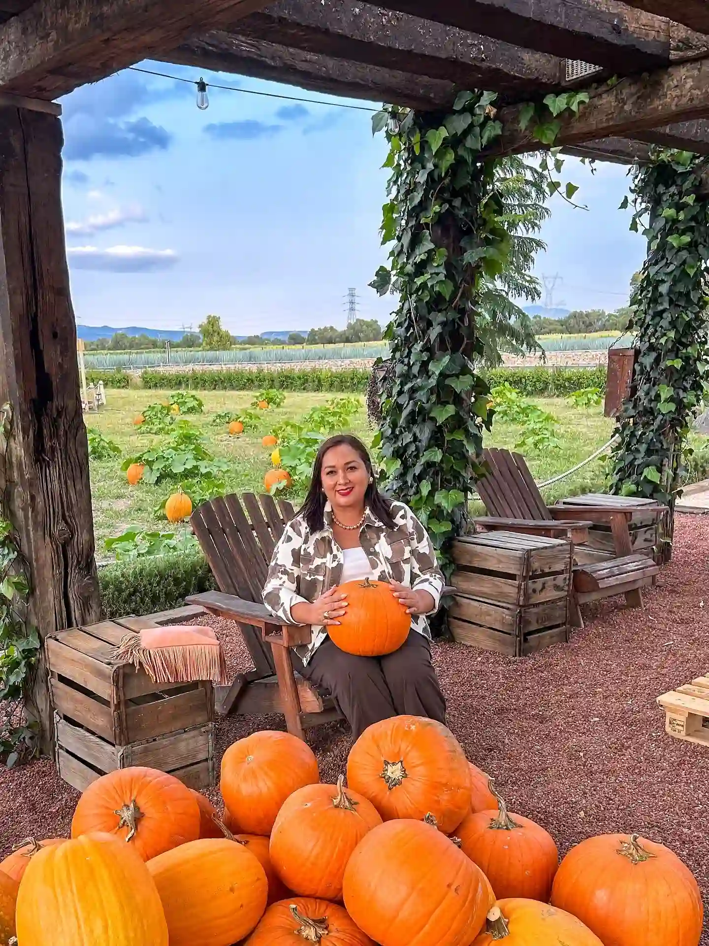 16 Pumpkin Patch Outfits Over 40 That Handle Mud, Hay, and Photos 18 10. Cow Print Shacket With A White Tank Top