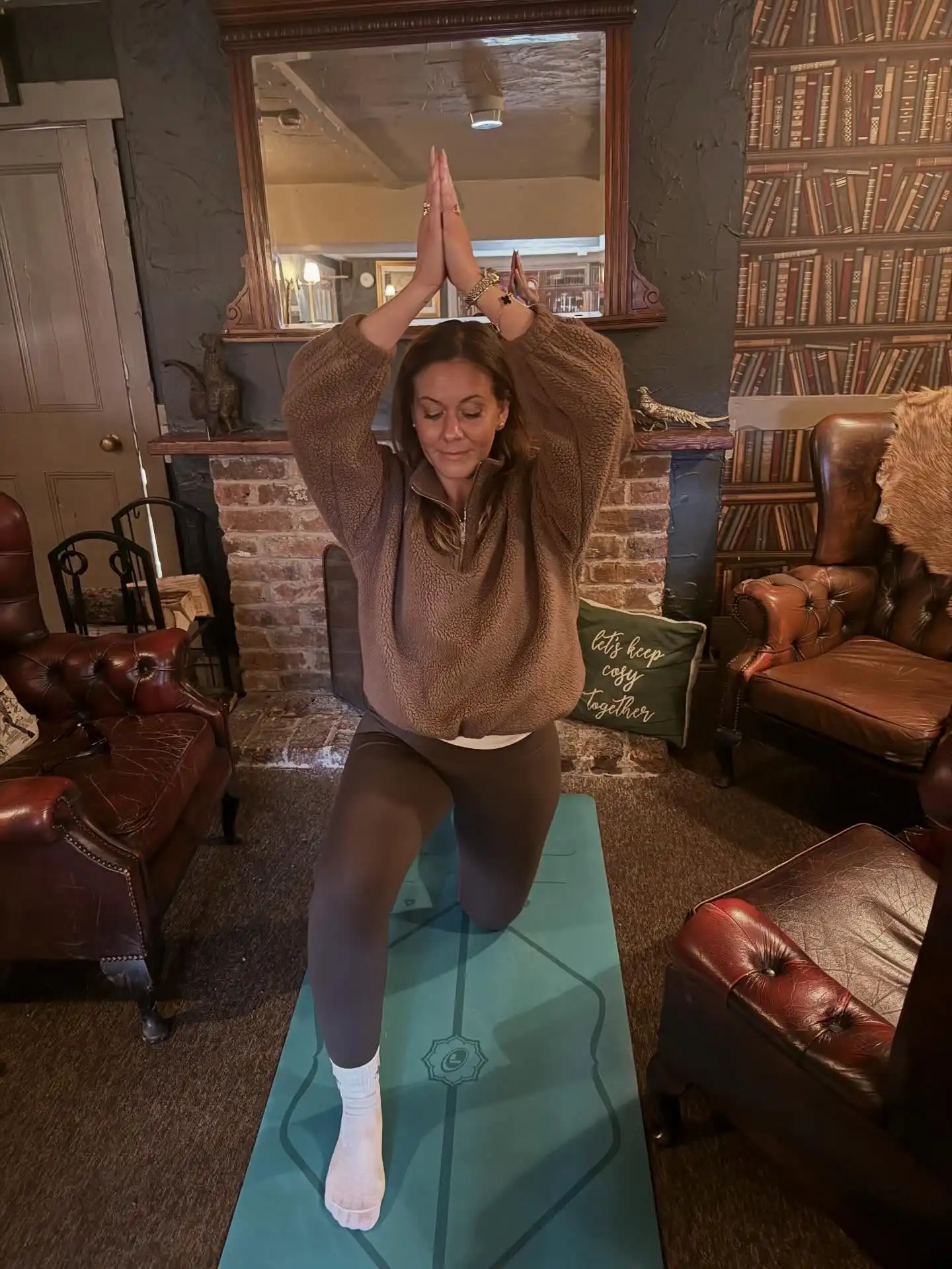 Pilates Outfits for Women Over 40: 10 Looks That Stay Put 10 9. Fleece Quarter Zip and Brown Leggings for Home Practice