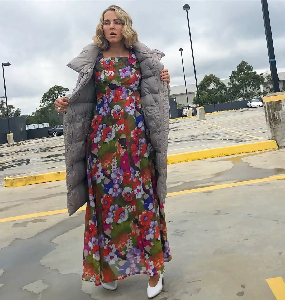 15 Puffer Jacket Outfits for Women Over 40 That Actually Look Chic 4 3. Layer a Long Puffer Over a Floral Maxi Dress
