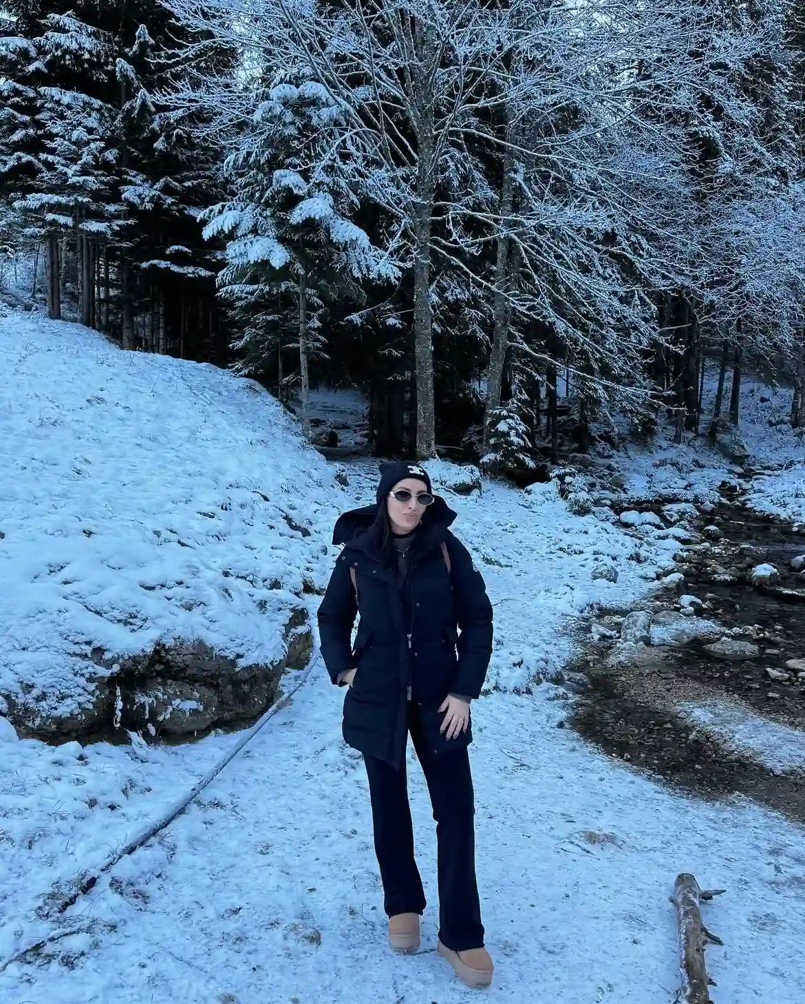 19 Winter Vacation Outfits Over 40 (Warm Getaways) 2 1. Navy Hooded Parka for Snowy Trail Days
