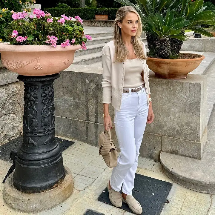 17 Italy Vacation Outfits for Women Over 40 That Look Effortlessly Chic 17 Beige Knit Twin Set with White Straight Jeans