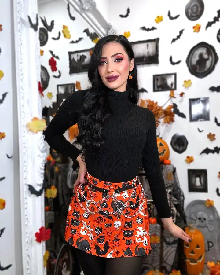 A Black Turtleneck With a Bright Halloween Print Skirt