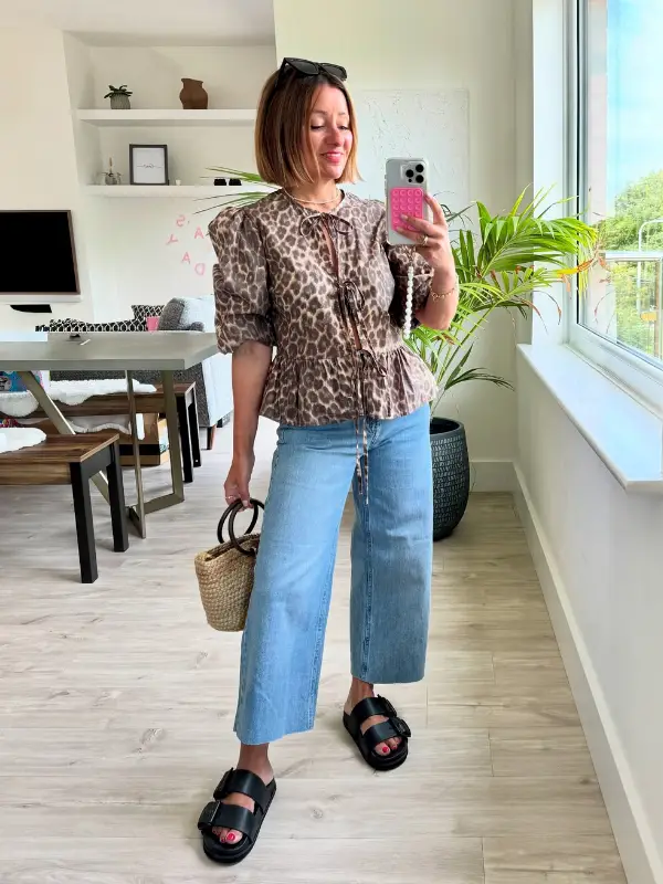 15 Business Casual Outfits for Women Over 40 9 8. Leopard Peplum Blouse with Wide Leg Jeans