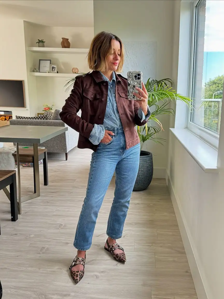 15 Chic Outfits for Women Over 40 You Can Copy This Week 4 Suede Jacket Over Double Denim With Leopard Flats