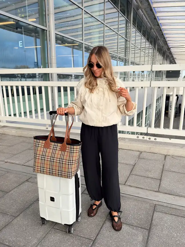 Cream Windbreaker with Black Drawstring Pants and Mesh Flats