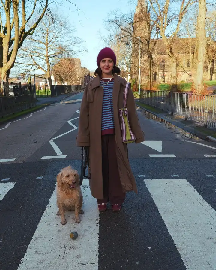 Camel Coat, Striped Sweater, and Burgundy Wide Trousers