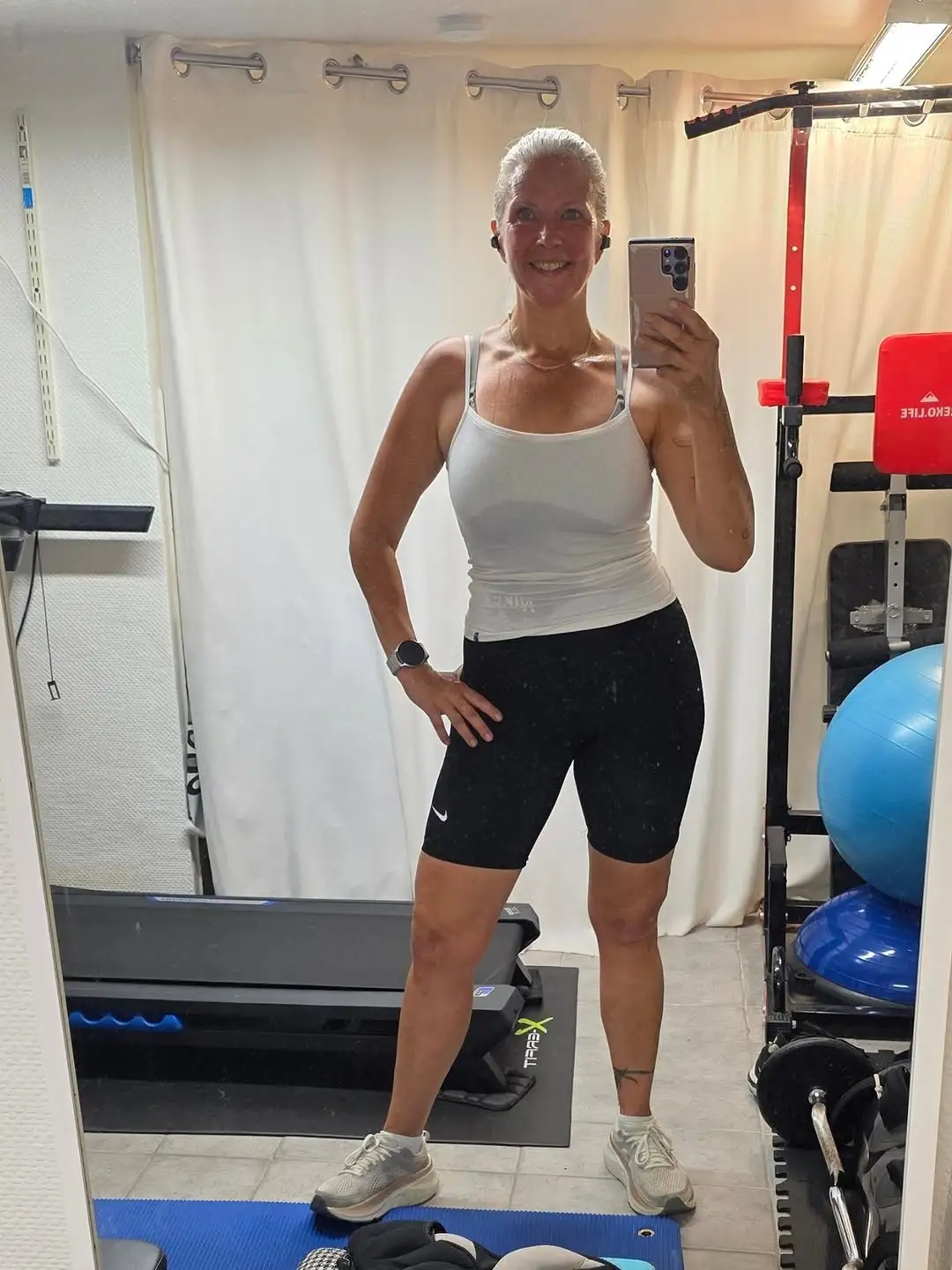 12 Gym Outfits for Women Over 40 13 12. White Tank and Nike Bike Shorts Combo