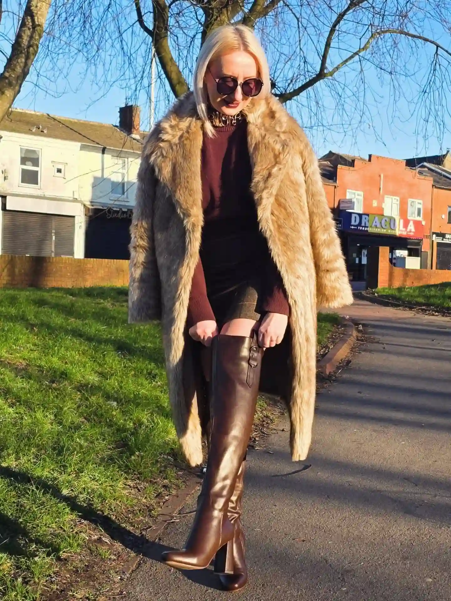 14 Knee-High Boot Outfits Over 40 12 11. A Faux Fur Coat Layered Over Metallic Boots