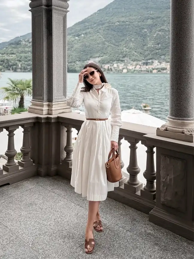 15 European Vacation Outfits for Women Over 40 16 White Shirt Dress with a Skinny Tan Belt