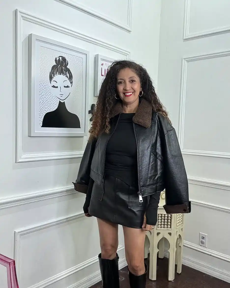 Modern Style: 20 Fall Outfits for Women Over 50 13 12. Leather Jacket with Skirt and Tall Boots