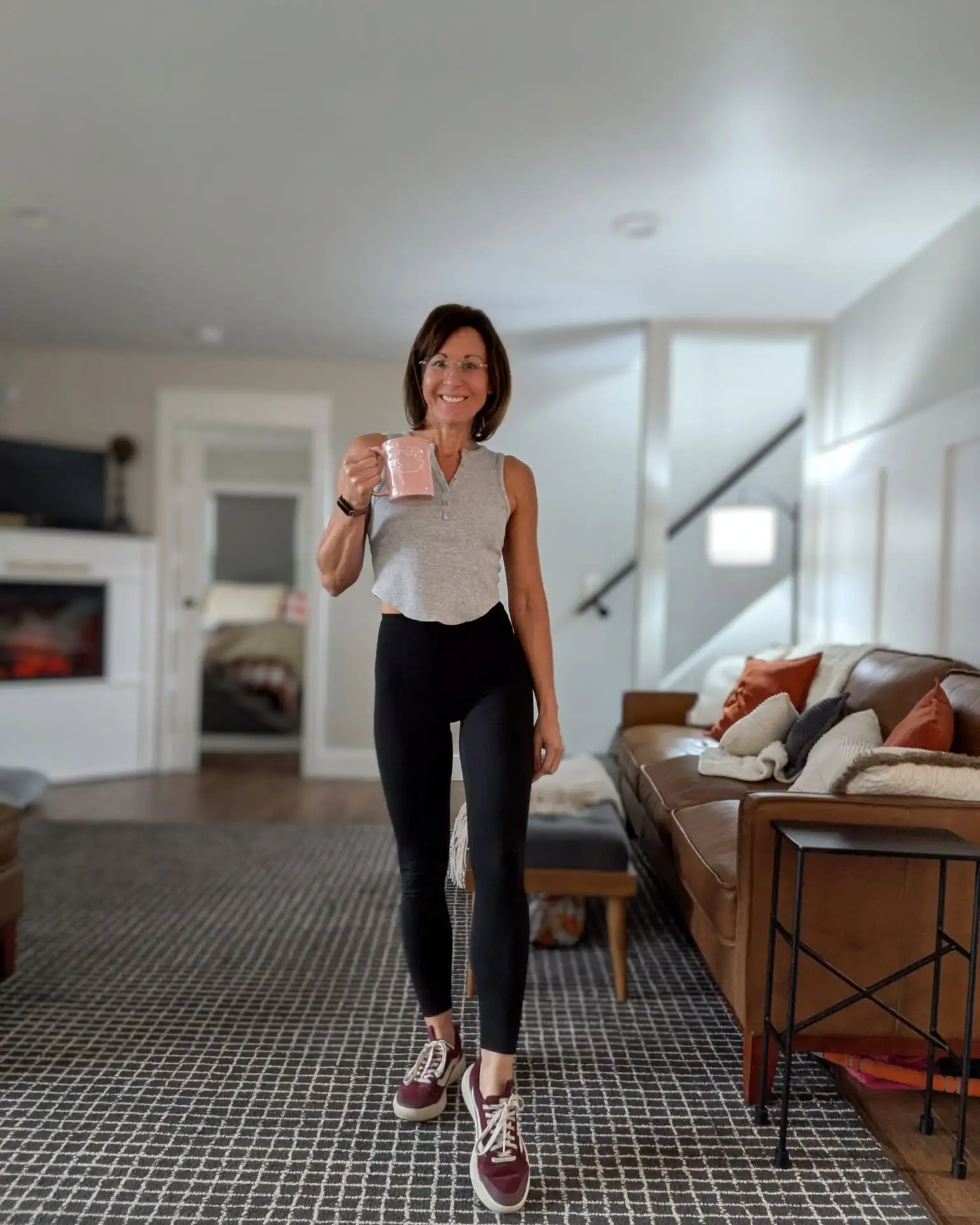 15 Leggings Outfits for Women Over 40 That Don't Look Sloppy 4 3. Cropped Tank Top with Black Leggings