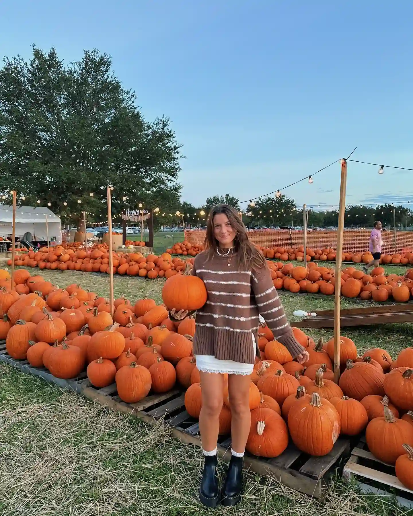 16 Pumpkin Patch Outfits Over 40 That Handle Mud, Hay, and Photos 12 4. Striped Sweater With A White Denim Skirt
