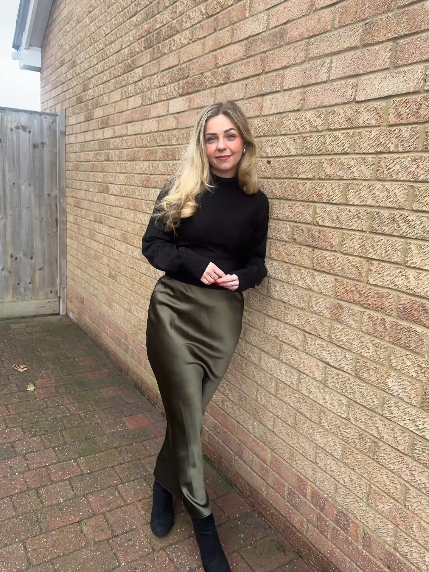 7. Olive Satin Midi Skirt With a Black Knit
