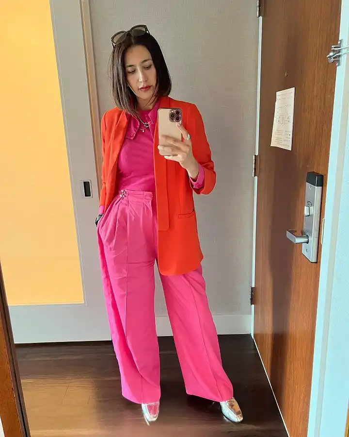 20 Classy Outfits for Women Over 40 3 Orange Blazer with Hot Pink Wide Leg Trousers